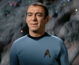 Lieutenant D'Amato, the senior geologist aboard the USS Enterprise serving under Captain James T. Kirk.